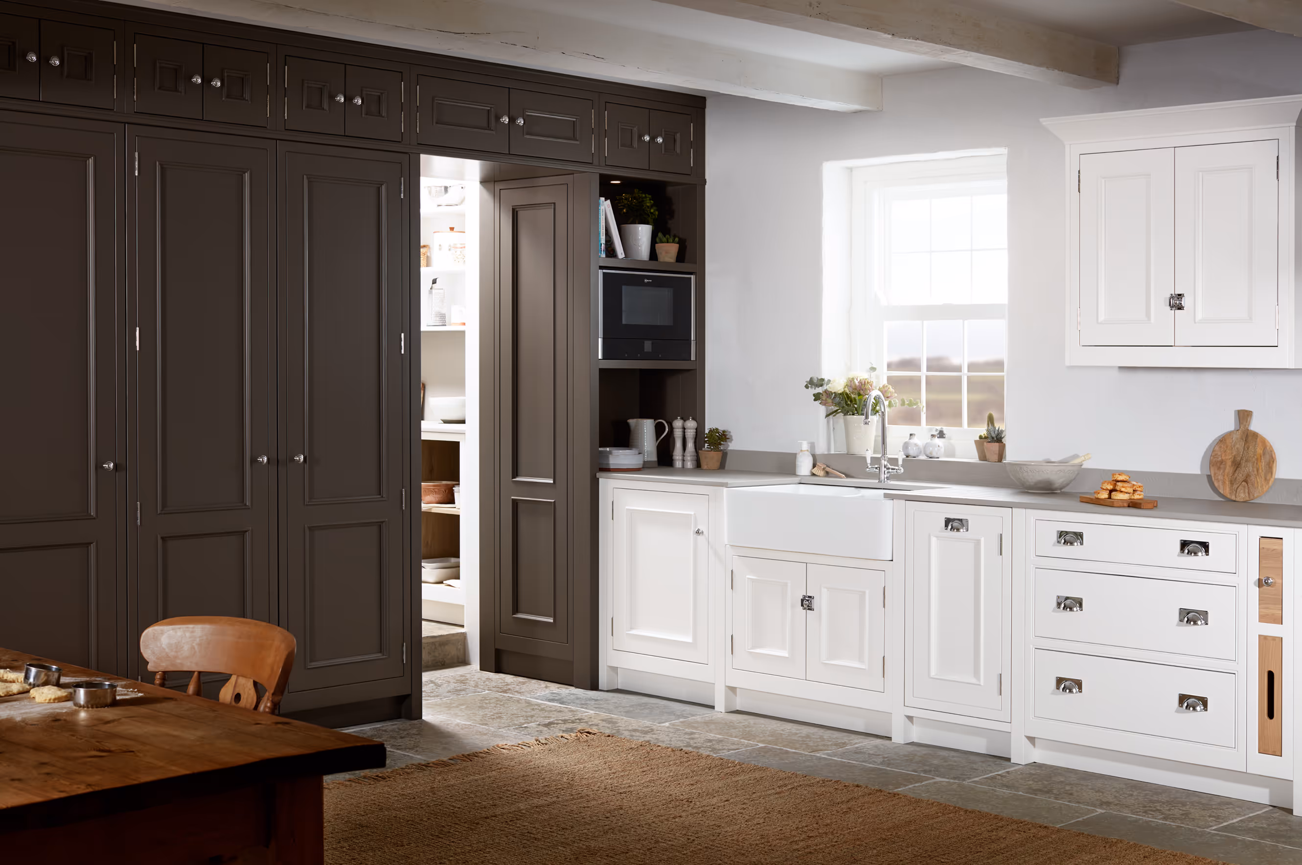 Classic cream Shaker-style bespoke kitchen with a large island